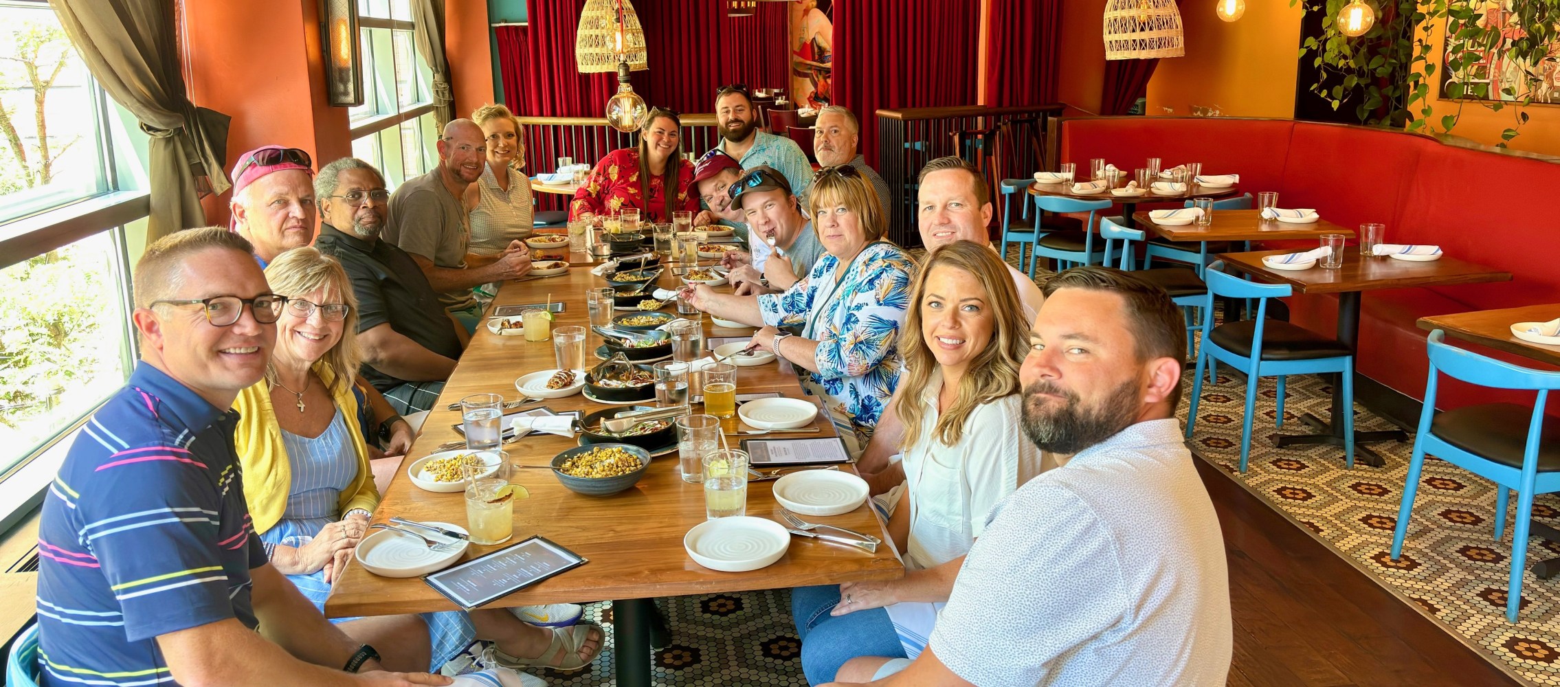 a group of people sitting at a table