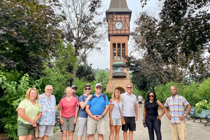 a group of people standing in a park